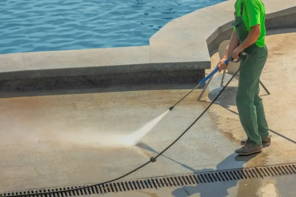 The pressure cleaner is doing pressure washing to clean a pool for a residential property in Wollongong NSW.